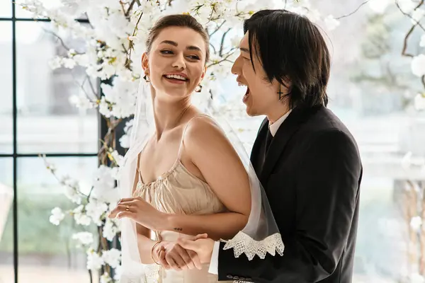 A bride and groom share laughter and love during their beautiful wedding ceremony. — Stock Photo