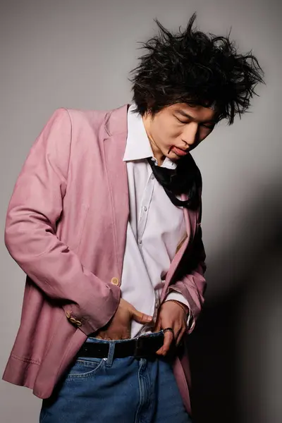 Asian man with blood on face in unique stylish outfit poses confidently in a studio during spring season. — Stock Photo