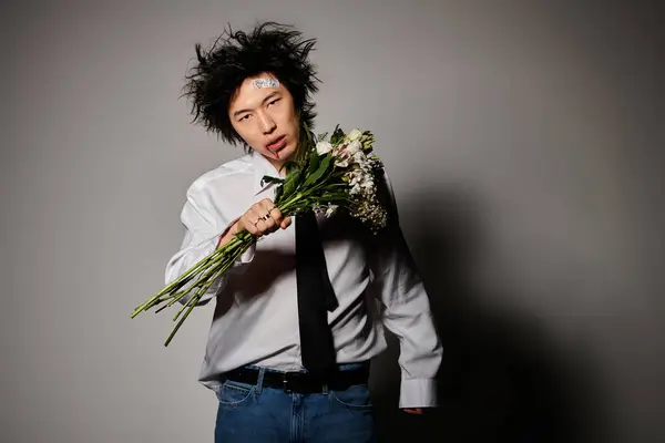 An Asian man with blood on face showcases modern spring fashion with flair and boldness in a studio. — Stock Photo