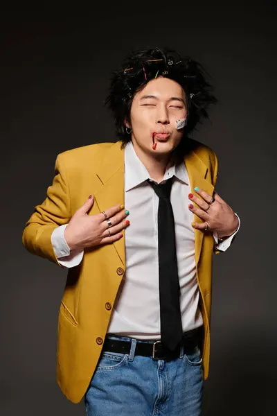 A confident asian man with blood on face kissing and showcasing creativity and individuality. — Stock Photo