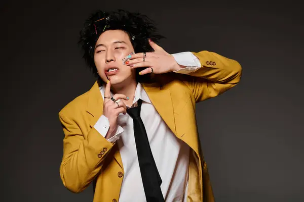 An asian man with blood on face feeling hurt, exuding modern fashion flair. — Stock Photo