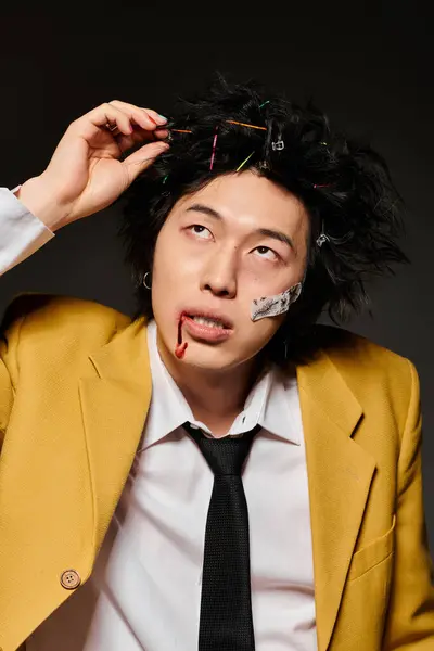 Stylish asian man with blood on face showcases unique fashion in a studio setting — Stock Photo