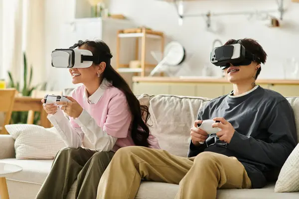 Couple engages in an immersive gaming session, bonding over virtual adventures at home. — Stock Photo