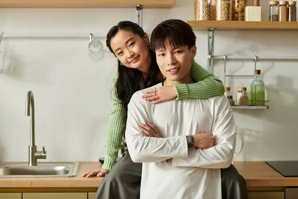 Couple enjoys a cozy breakfast in their kitchen, sharing love and laughter. — Stock Photo