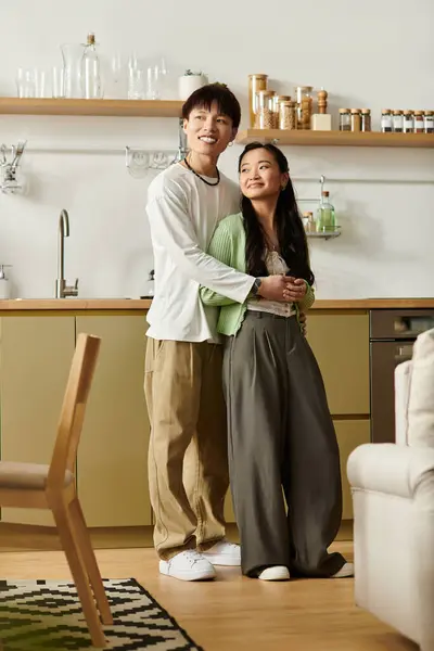 A young couple shares a cozy breakfast moment in their stylish home, radiating happiness. — Stock Photo