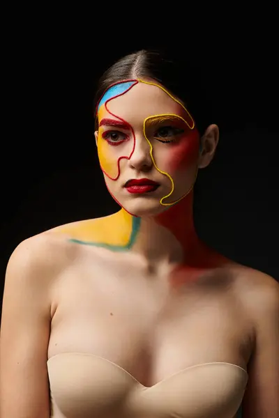 A stunning young woman displays vibrant face art that captivates attention. — Stock Photo