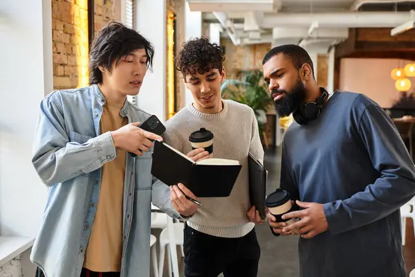 Three professionals engage in a lively discussion while reviewing notes and enjoying coffee. — Stock Photo