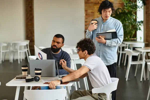 Team members actively collaborate around a table in a sleek office, exchanging ideas and insights. — Stock Photo