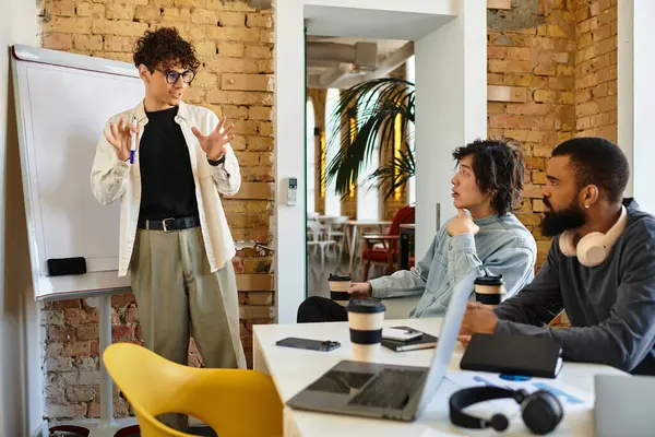 Colleagues engage in a lively discussion, exchanging ideas and insights in a vibrant workspace. — Stock Photo