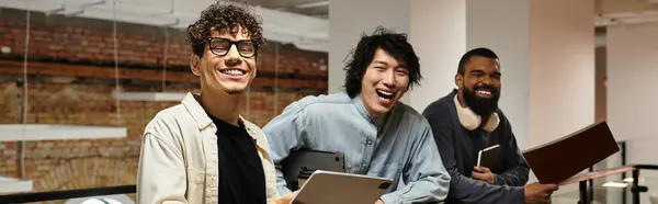 Energetic professionals share laughter while collaborating in a stylish office environment. — Stock Photo