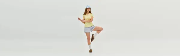 A beautiful young woman radiates happiness as she dances gracefully in a bright, airy space. — Stock Photo