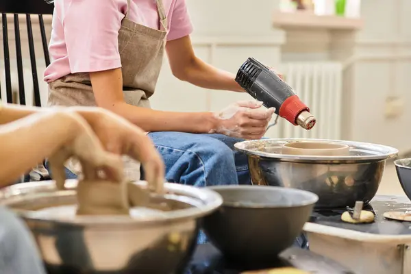 A young couple shapes their love into beautiful pottery creations together. — Stock Photo