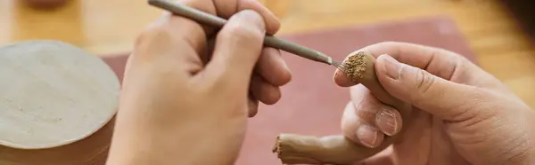 Skilled hands shape clay into art while exploring pottery in a vibrant studio. — Stock Photo