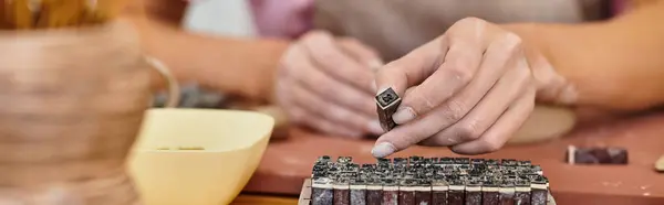 An artisan crafts intricate pottery in a bright, inspiring studio. — Stock Photo