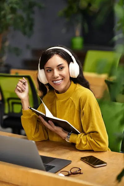 Elegant woman enjoys a captivating moment of inspiration while working diligently in her office. — Stock Photo