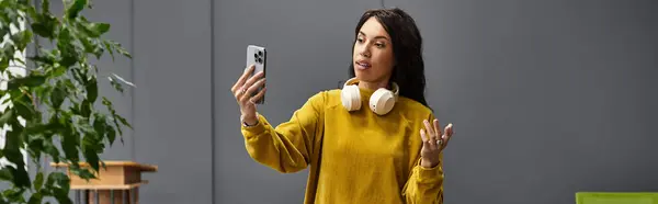 Young professional showcases her charm while working in a contemporary office environment. — Stock Photo