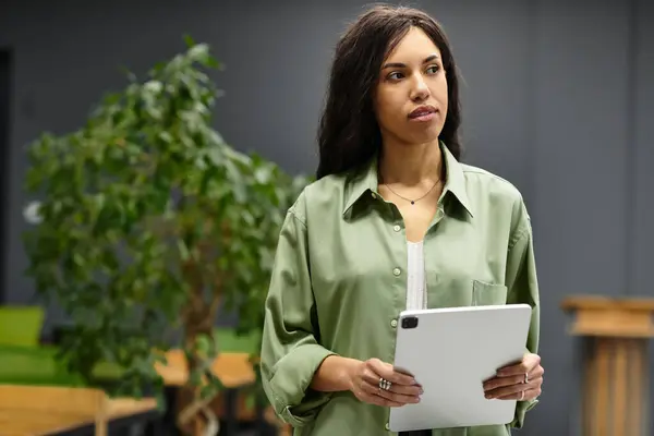 Young woman works in a stylish office, showcasing professionalism and elegance. — Stock Photo