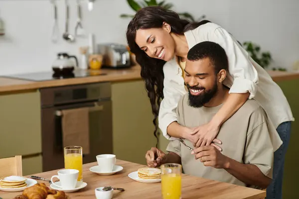African American couple shares a joyful morning, surrounded by delicious food and love. — Stock Photo