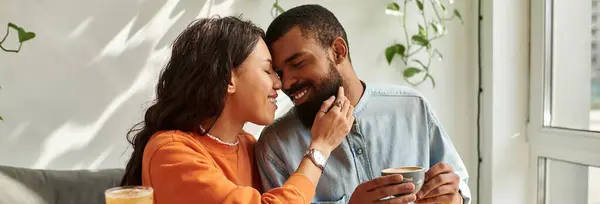 African American couple shares a warm moment while working remotely in a vibrant cafe, banner — Stock Photo