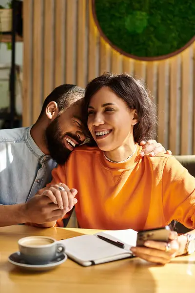 An African American couple enjoys their time together, sharing laughter and affection in a cafe. — Stock Photo