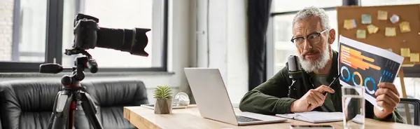 A focused person shares insights with presentation materials in a modern workspace. — Stock Photo
