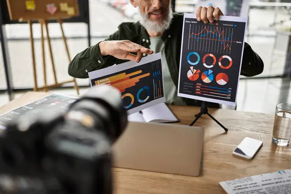 A professional shares insights with charts in a sleek office during a business meeting. — Stock Photo