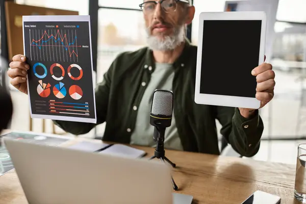 Professional sharing insights using charts and a tablet during a collaborative meeting — Stock Photo