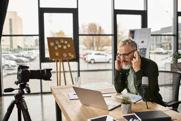 A professional speaking on a video call in a modern office filled with natural light. — Stock Photo