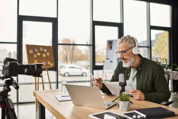 A man with glasses shares ideas in a stylish office during a virtual meeting. — Stock Photo