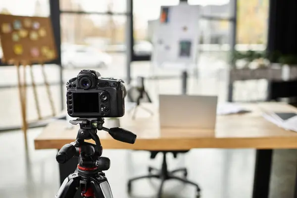 A quality camera on a tripod, set to capture content in a chic office space. — Stock Photo