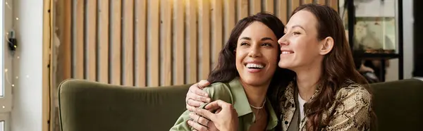 Two women share laughter and affection while enjoying each others company in a cafe. — Stock Photo