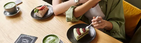 Two women savor delicious desserts together at a cozy cafe, sharing laughter and connection. — Stock Photo