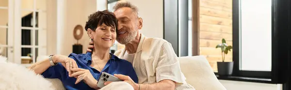 A middle aged couple enjoys quality time together, sharing smiles and affection at home, banner — Stock Photo