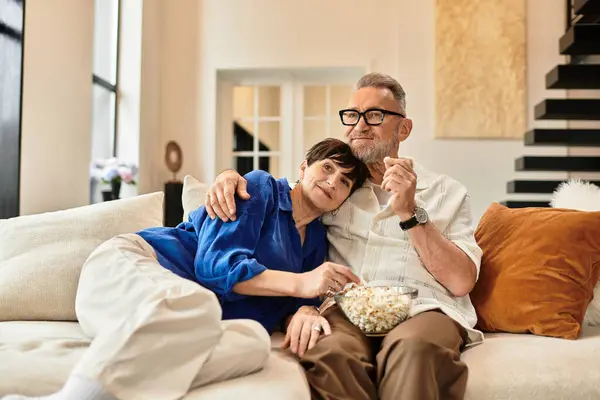 This joyful couple is sharing a delightful evening together, relaxing at home. — Stock Photo