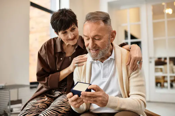 A happy couple enjoys a heartfelt moment at home, celebrating their love and connection. — Stock Photo