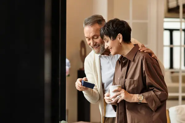 Middle aged husband and wife share a joyful moment, laughing and enjoying each other's company. — Stock Photo