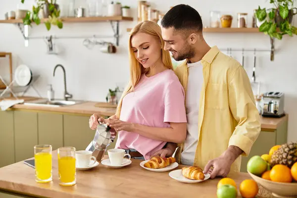 A couple enjoys a lovely morning at home, prepared to share breakfast with joy and affection. — Stock Photo