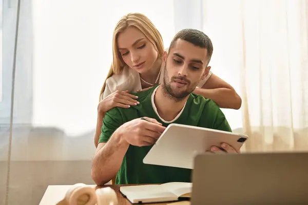 Loving couple enjoys quality time at home, engaging in productive activities and sharing smiles. — Stock Photo