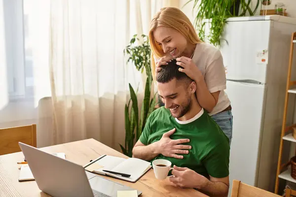 A couple enjoys each others company at home, surrounded by warmth and affection over coffee. — Stock Photo