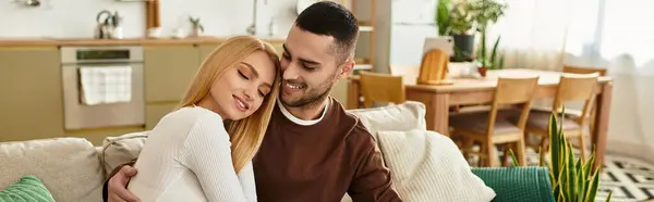 A couple cuddles on a couch, savoring each others warmth in a cozy home. — Stock Photo