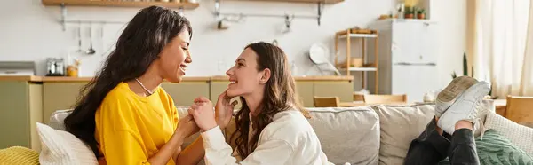 Inside a cozy home, two women express their affection for each other, smiling and connecting. — Stock Photo