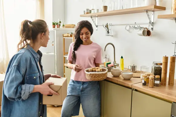 Two women enjoy each others company as they prepare delicious snacks together at home. — Stock Photo