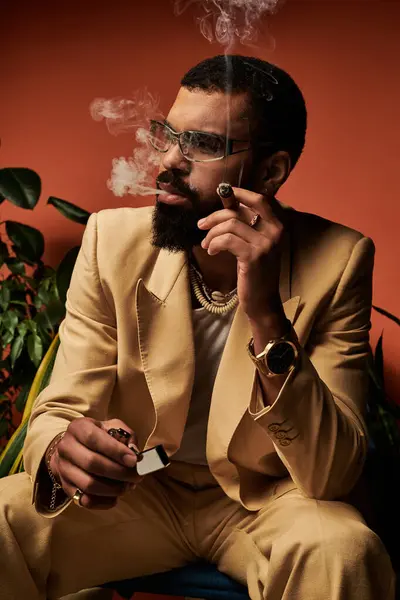 A handsome man relaxes while smoking, showcasing summer fashion and a confident vibe. — Stock Photo