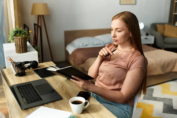 A young woman relaxes in her beautiful home while enjoying coffee and deep in thought. — Stock Photo