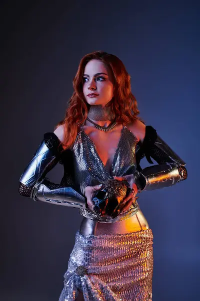 A young woman embodies elegance in a knight inspired outfit, holding a symbolic orb. — Stock Photo
