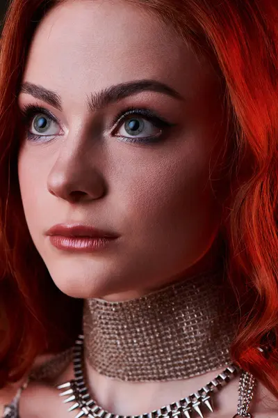 A young woman with red hair showcases stunning elegance and fashion in a castle core atmosphere. — Stock Photo