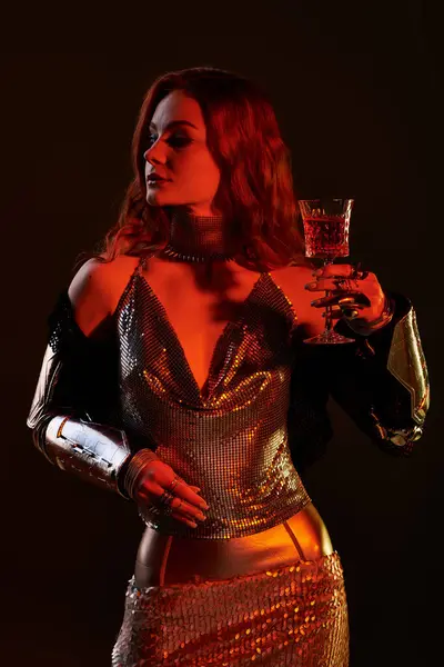 A beautiful woman in stunning attire sips a vibrant drink, embodying castle core charm. — Stock Photo