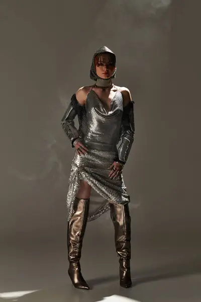 A young and beautiful woman showcases her elegance in a shimmering outfit, exuding timeless charm. — Stock Photo