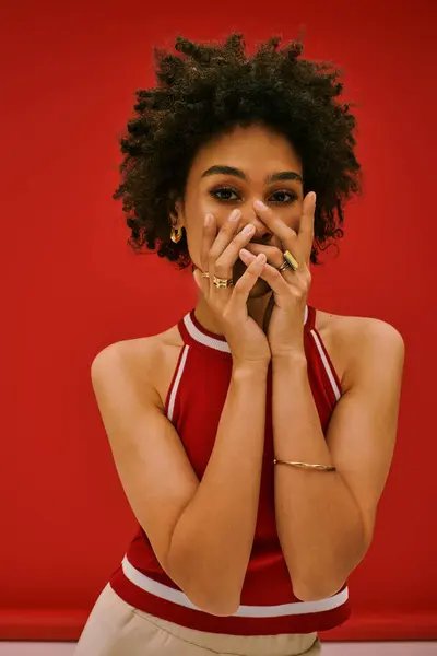 A youthful woman exudes playfulness in bold colors, embodying modern fashion. — Stock Photo