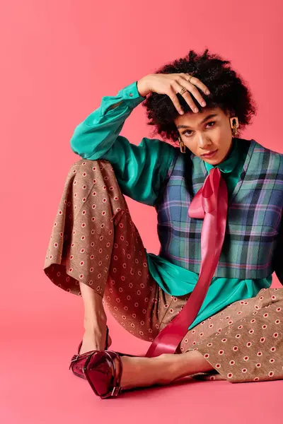 A young woman poses confidently in colorful attire, captivating the vibrant atmosphere. — Stock Photo